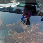 Blue shirt pilot flying plane