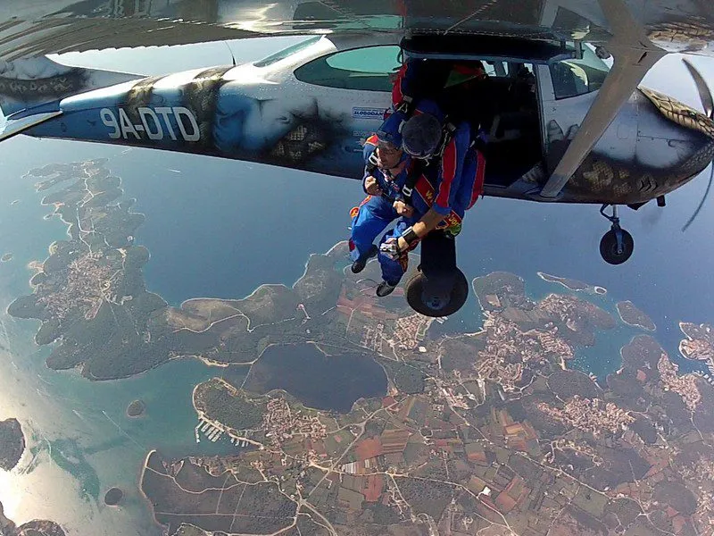 Blue shirt pilot flying plane