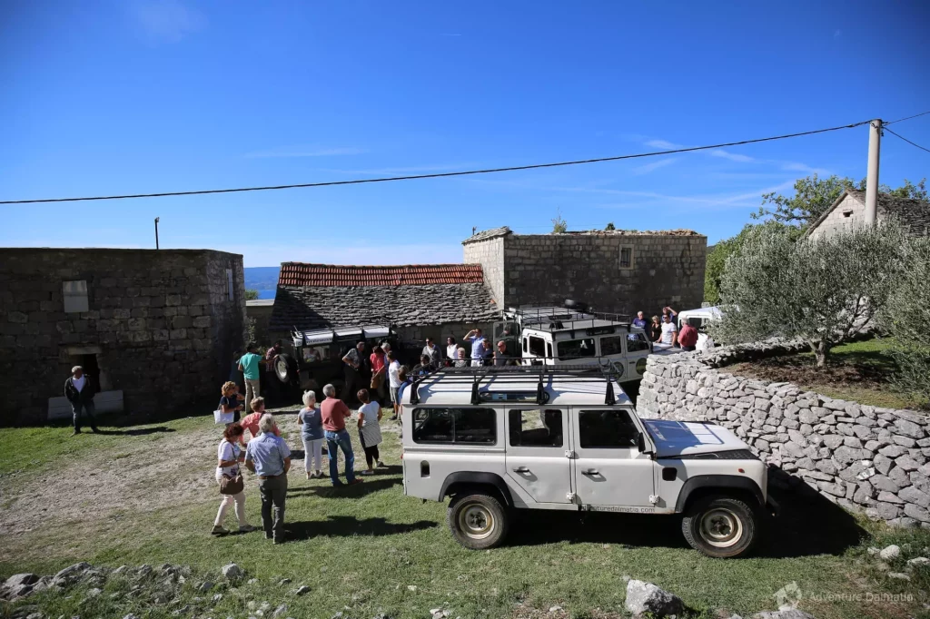 Group at truck in field