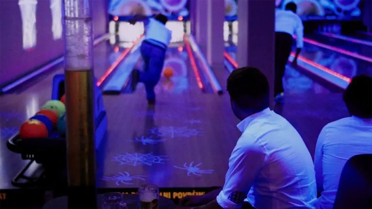 Group playing pool in split
