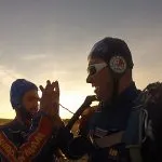 Helmeted men posing for camera
