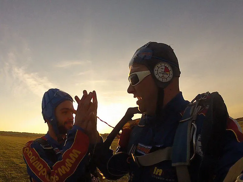 Helmeted men posing for camera