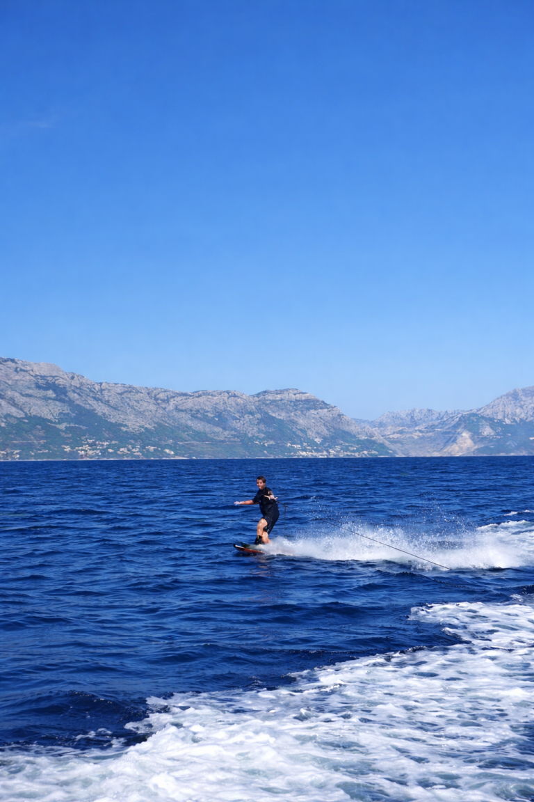 Wakeboarding behind the boat on the Adriatic near Split