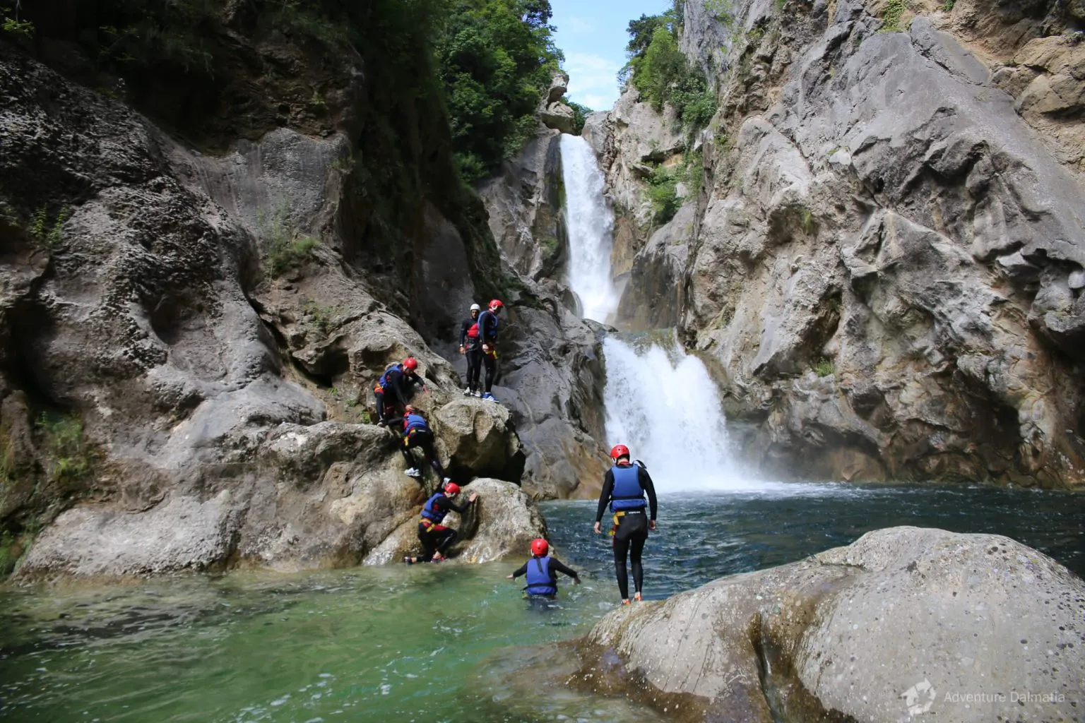 Canyoning near a waterfall on the Cetina
