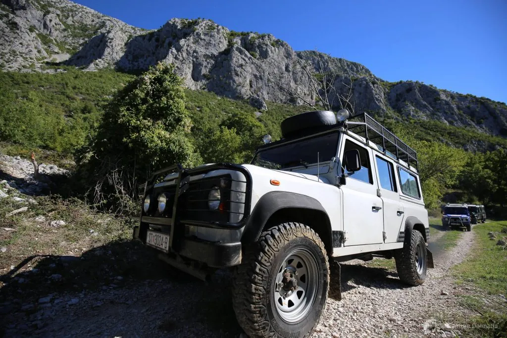 White truck on rocky road