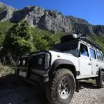 White truck on rocky road