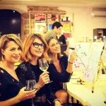 Women cheers wine glasses