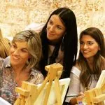 Women lounging by the sea